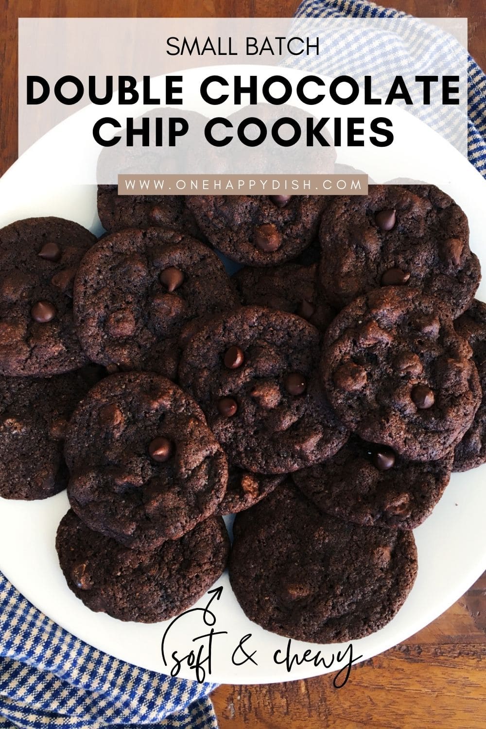 Freshly baked soft and chewy double chocolate chip cookies on a white serving plate.