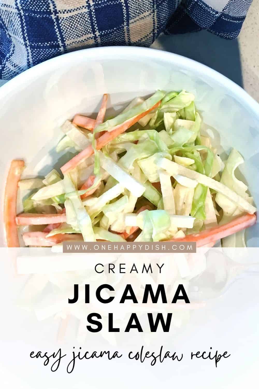 Creamy jicama slaw in a small white salad bowl.