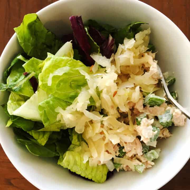 Tuna sauerkraut salad in a white serving bowl.