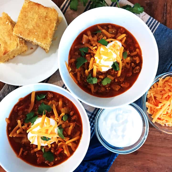Quick and easy chili with a dollop of sour cream and shredded cheese.