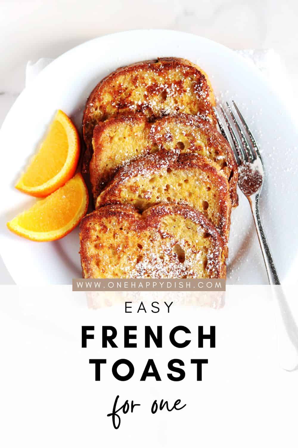French toast with fresh orange slices on a white plate.