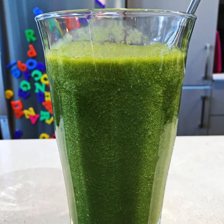 Green smoothie in a tall glass.