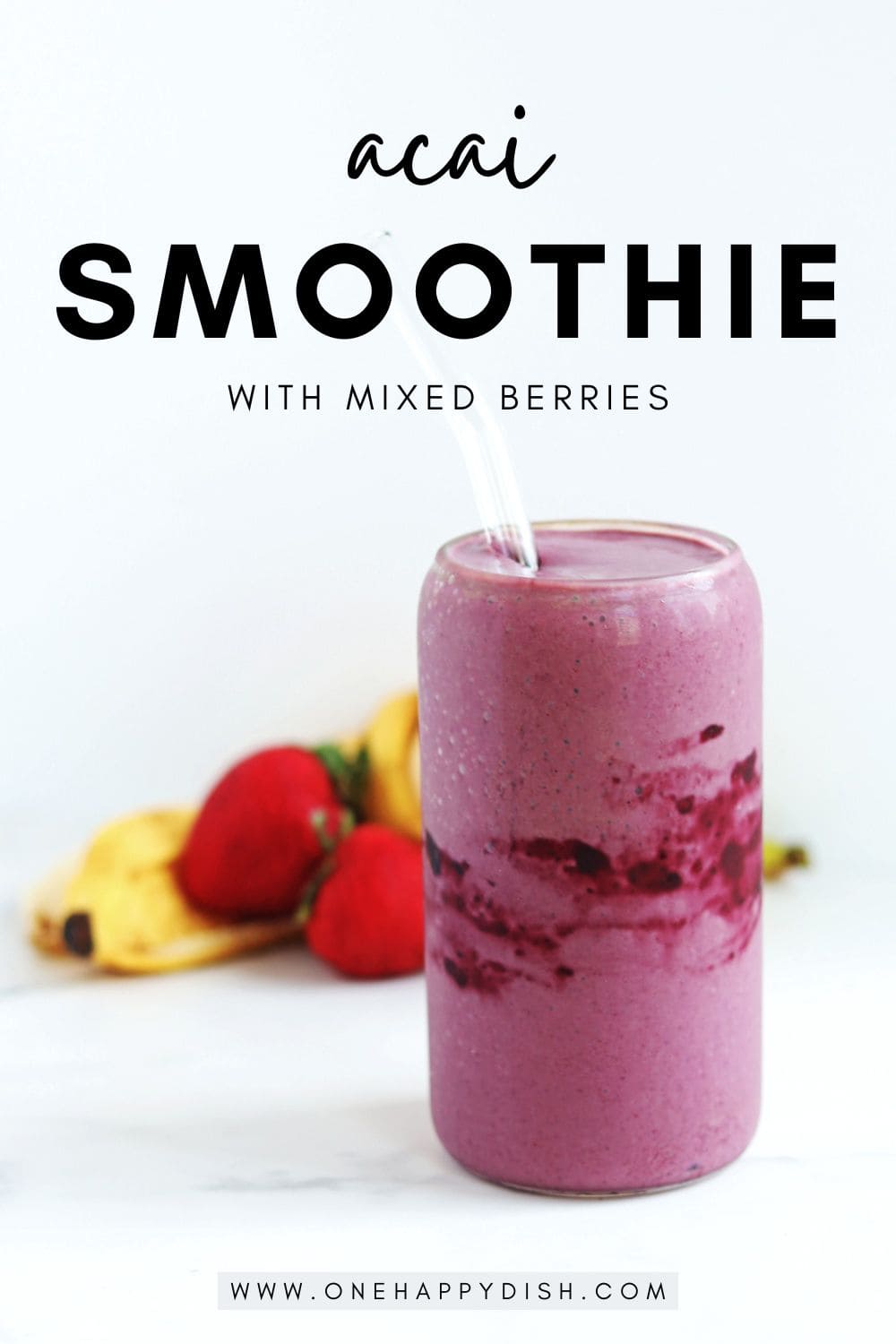 An acai smoothie with a glass straw.