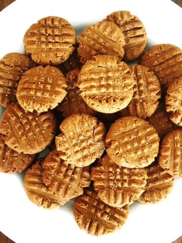 3 ingredient peanut butter cookies on white plate.