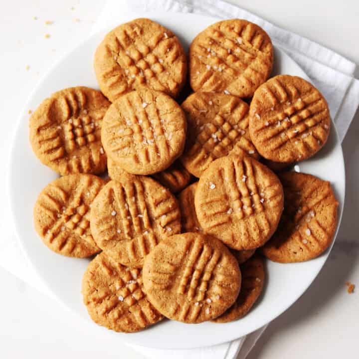 3 ingredient peanut butter cookies on white plate.