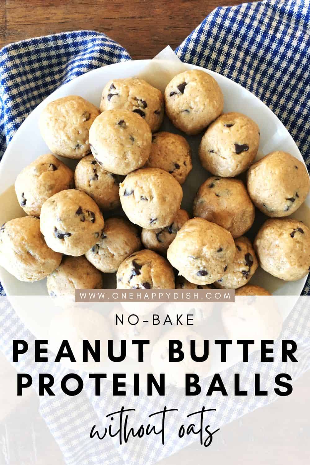 Peanut butter protein balls with chocolate chips on a white plate.
