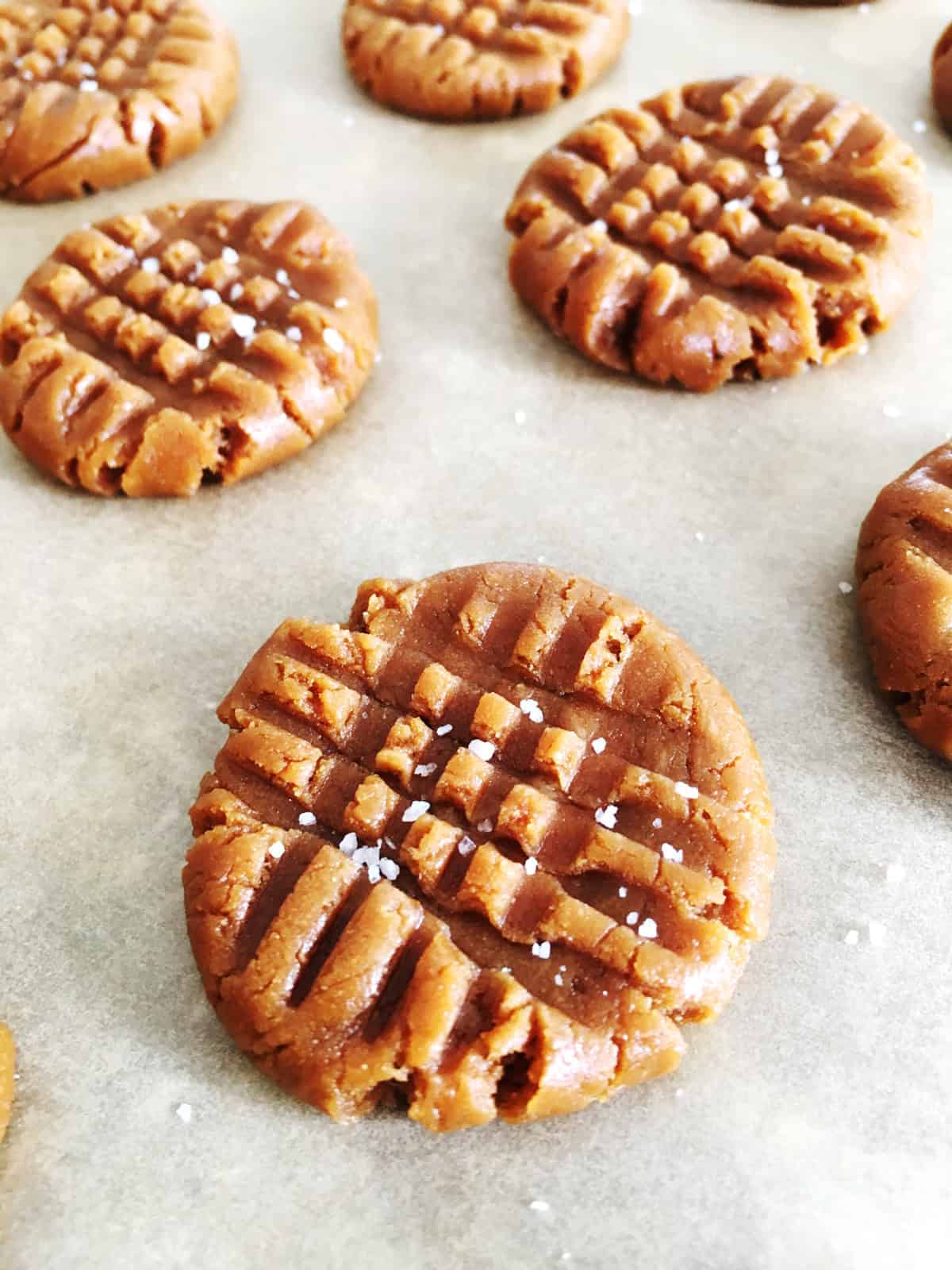 Close up of peanut butter cookies sprinkled with sea salt.