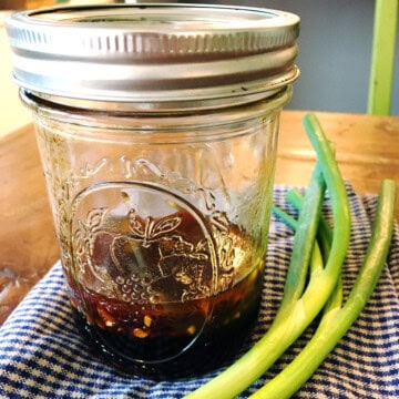 Asian salad dressing in a small Mason jar.