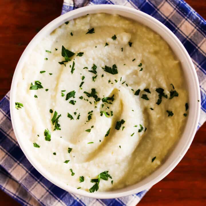 Garlic mashed cauliflower garnished with fresh parsley.