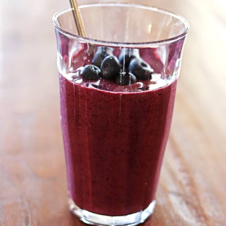 Blueberry kefir smoothie topped with fresh blueberries.