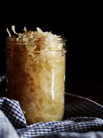 Homemade sauerkraut in a glass Mason jar.