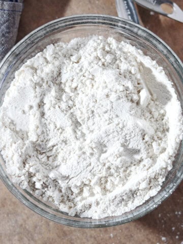 Homemade self rising flour in a glass bowl.