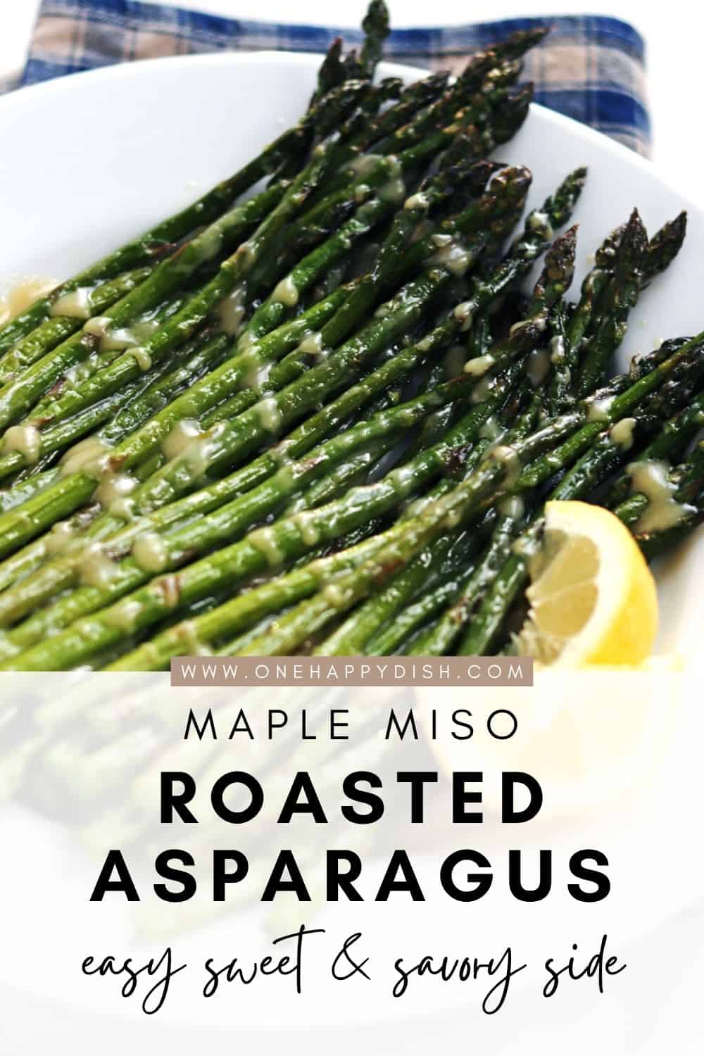 Oven roasted asparagus with maple miso glaze on a white plate.