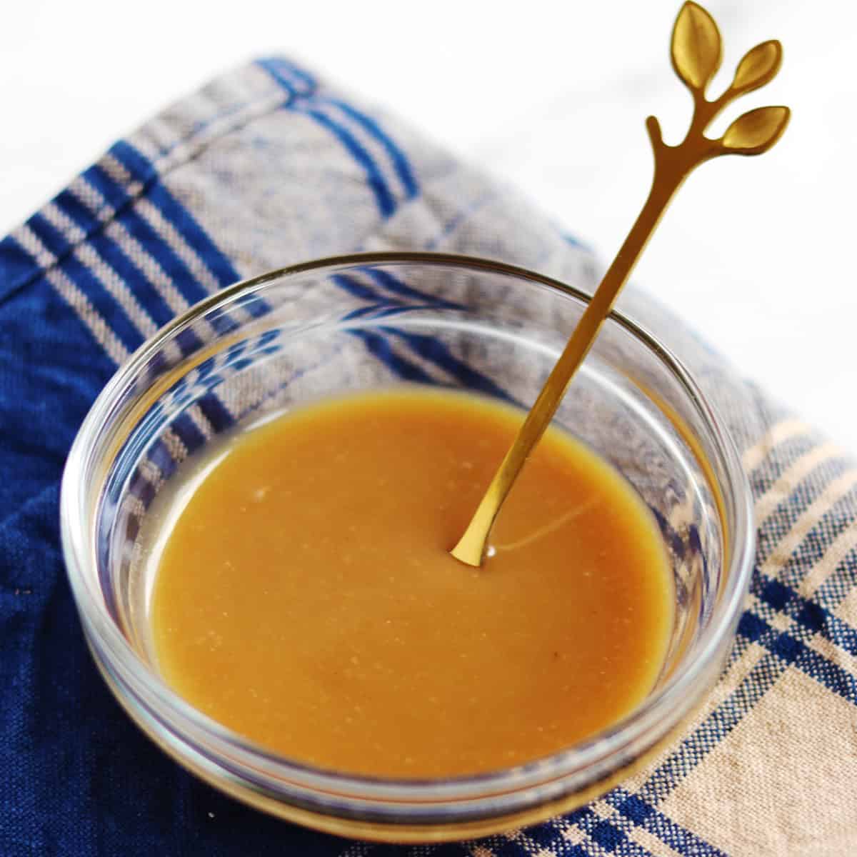 Homemade miso sauce in a small glass bowl.
