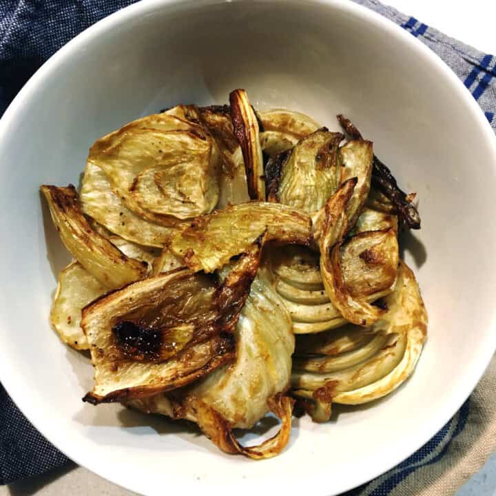 Roasted fennel in a white serving bowl.