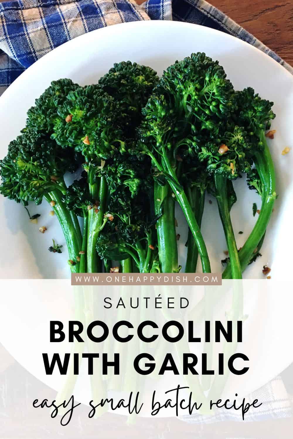 Sautéed broccolini with garlic on a white plate.