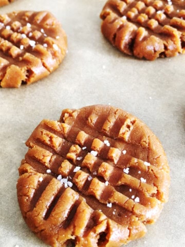 Close up of peanut butter cookies sprinkled with sea salt.
