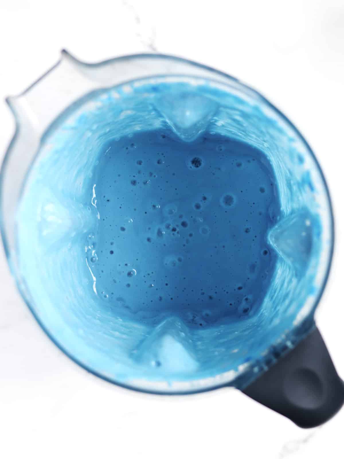 Blue smoothie in a high speed blender.