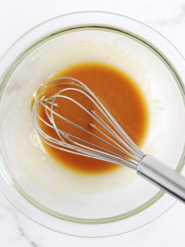 Maple miso sauce in a glass mixing bowl.